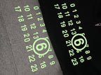 Black Maison Margiela hoodie with neon green numeric logo print