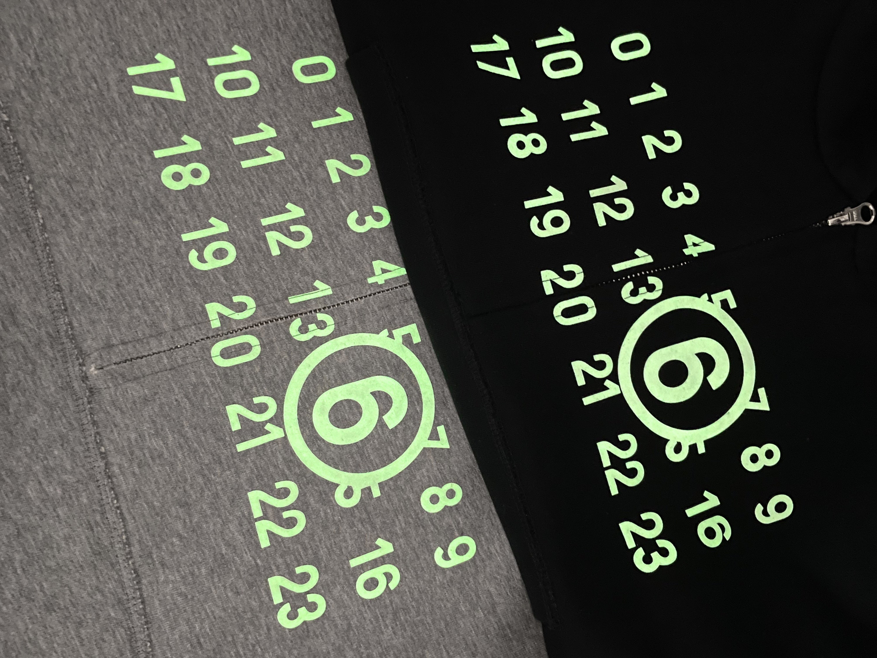 Black Maison Margiela hoodie with neon green numeric logo print