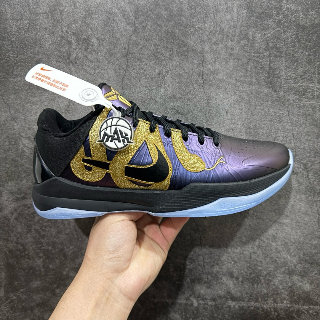 Basketball sneaker side view in dark purple with gold logos and black laces
