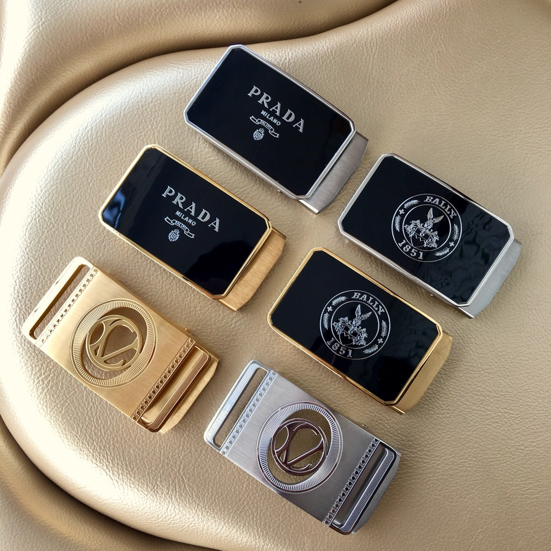 Assorted Prada belt buckle designs on a beige surface, mixed metal and black