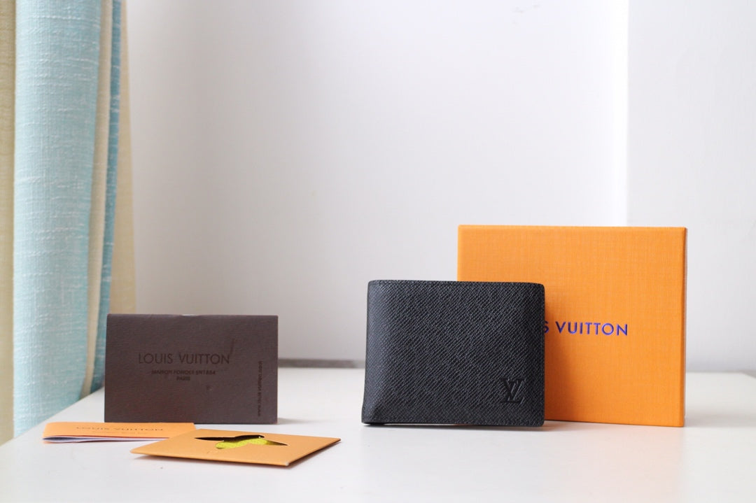 Louis Vuitton small black textured leather pouch with LV emblem on the front
