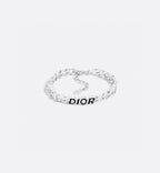 Silver-tone DIOR chain bracelet with oval and bar links, flat-lay view