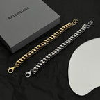 Balenciaga chain bracelets: gold and silver tone curb links with small clasps