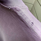 Off White lavender T-shirt hem close-up with double stitching along side seam