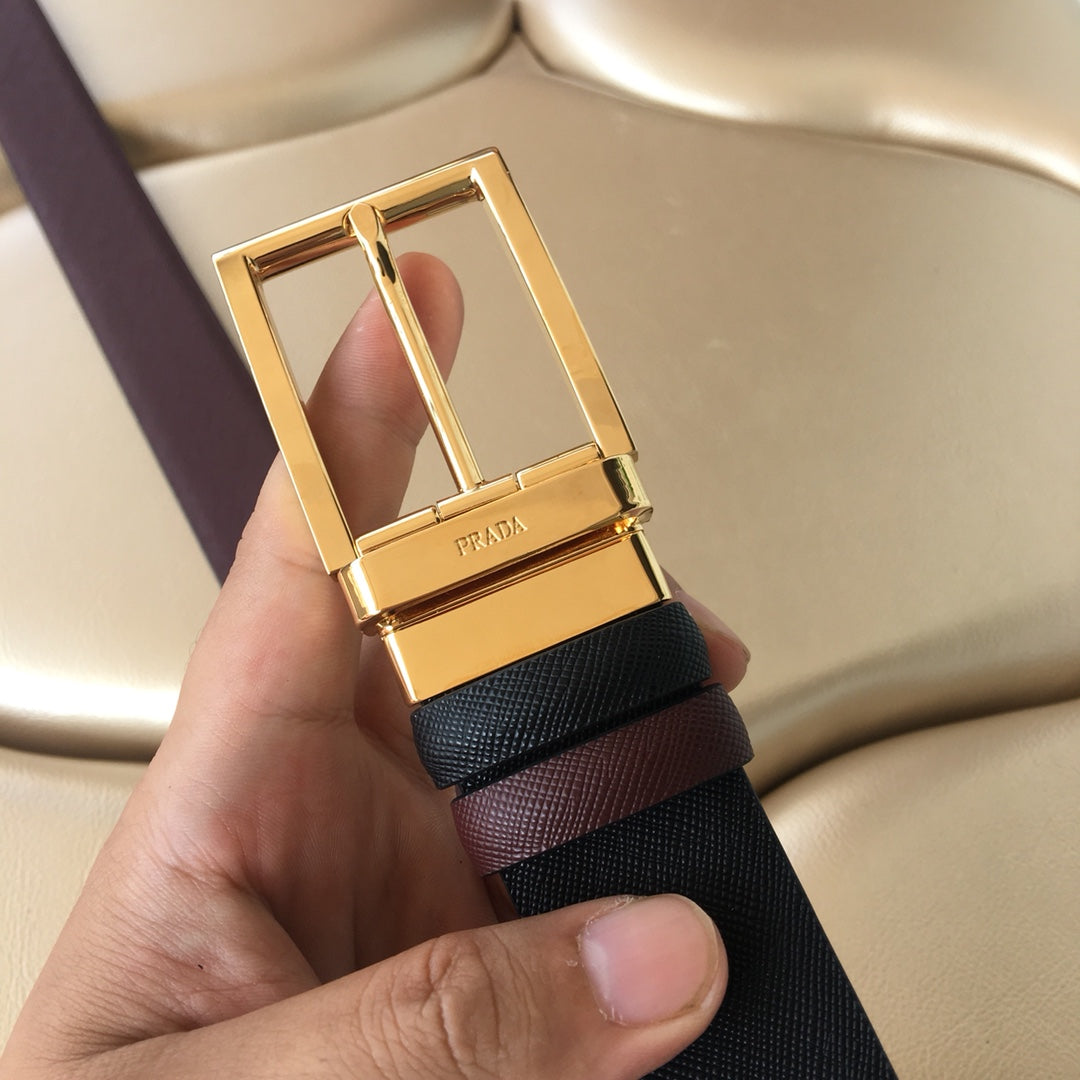 Prada belt buckle view: gold square frame with prong on dark strap.