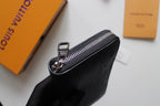 Dark textured leather zip wallet with metal zipper pull and front ring