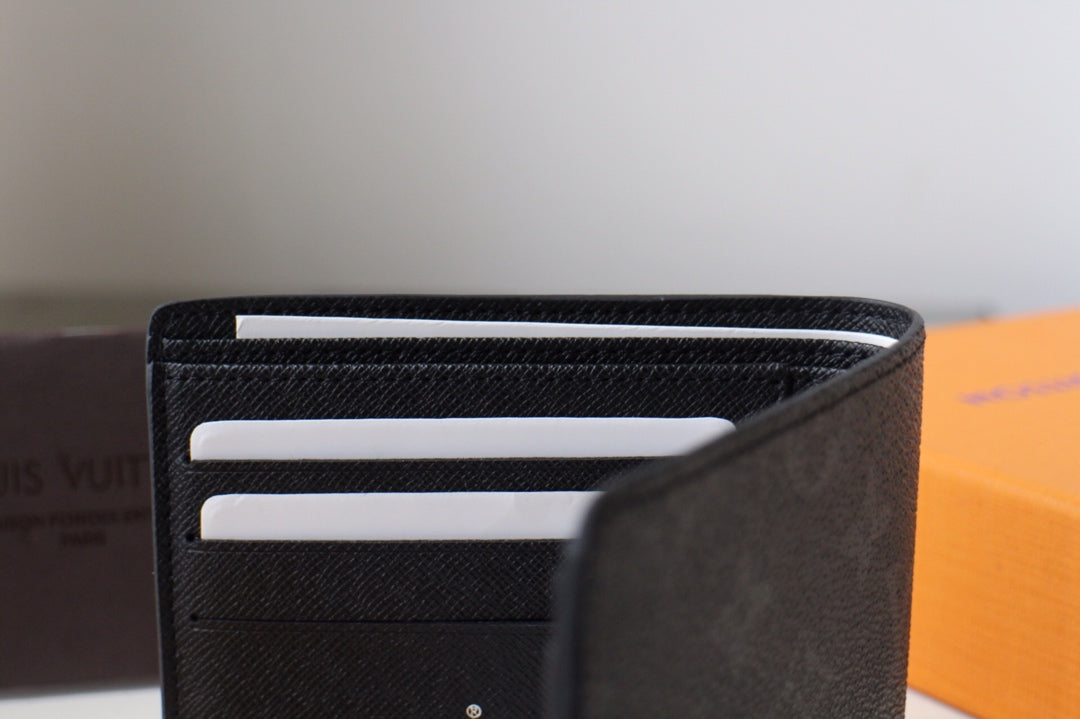 Louis Vuitton small bag, black leather card holder with three horizontal card slots