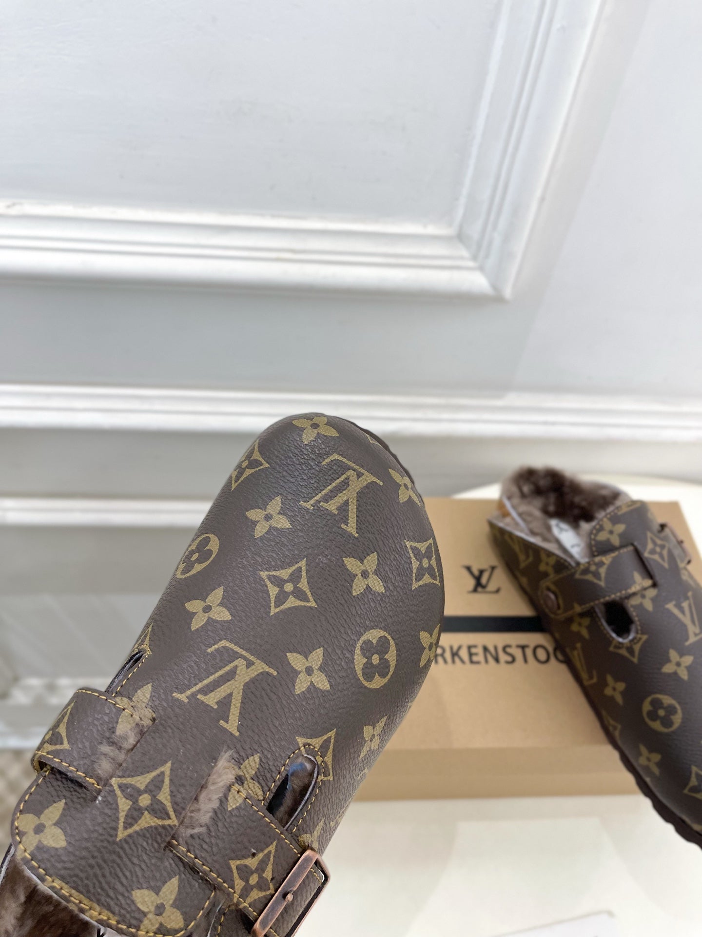 Louis Vuitton monogram sandals with two buckles and cushioned faux-fur footbed