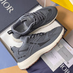 Unisex Dior sneakers in blue-gray with lace-up design and thick off-white sole.