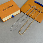 Set of chain necklaces in gold- and silver-tone with small square charm and clasps.