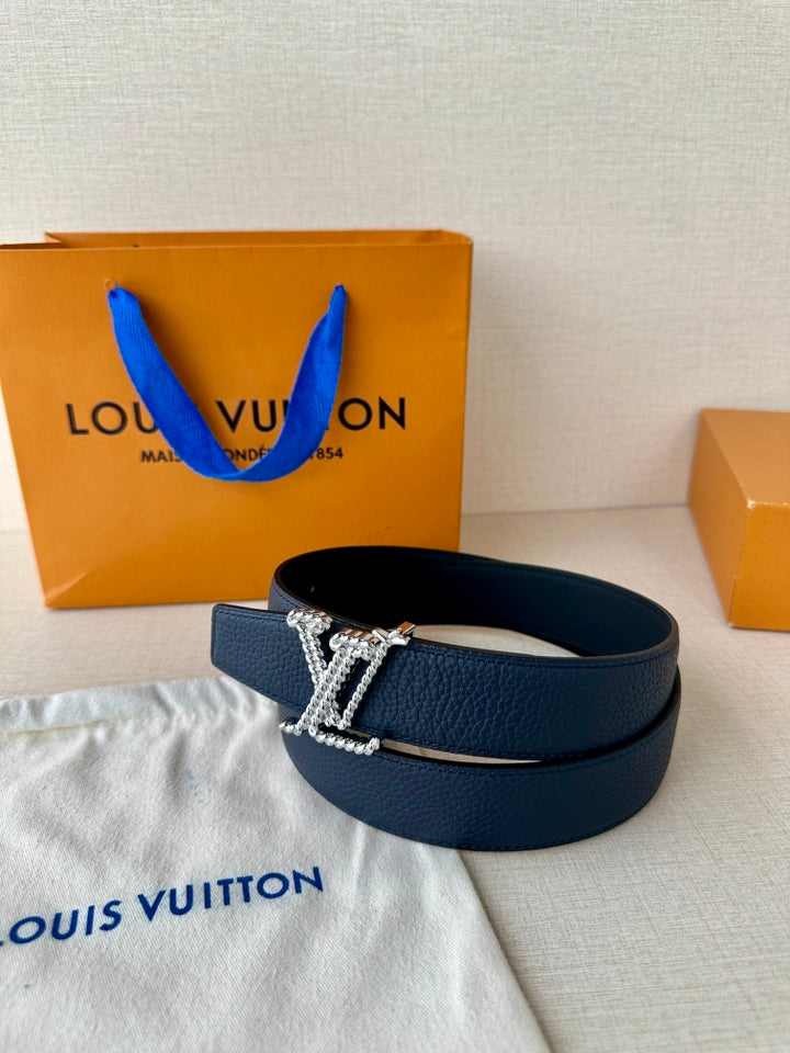 Louis Vuitton leather belt dark blue with gold-tone LV buckle, angled side view