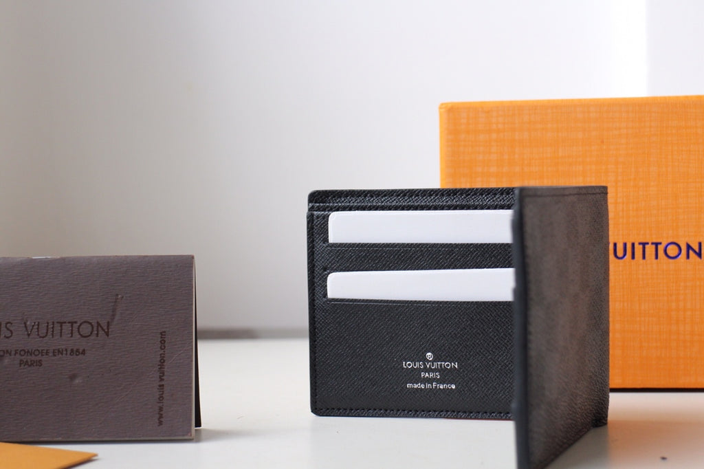 Louis Vuitton wallet open with two card slot rows visible