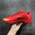 Red basketball shoe with gold detailing, black logo, and lace-up closure