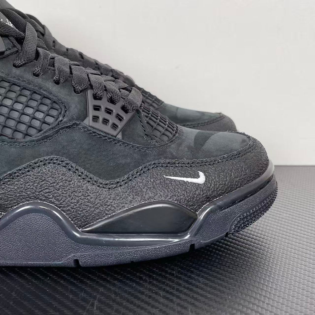 Air Jordan 4 sneakers, dark gray suede with lace-up front, mesh panel, and Air midsole