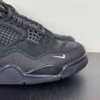 Air Jordan 4 sneakers, dark gray suede with lace-up front, mesh panel, and Air midsole