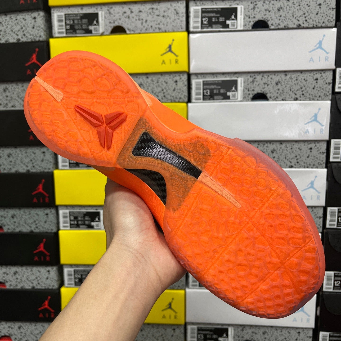 Orange rubber outsole with traction tread pattern