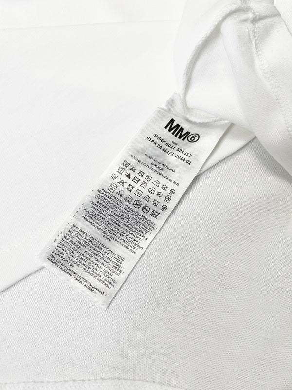 White T-shirt with attached fabric care label at side seam