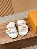 Louis Vuitton monogram slide sandals, tan buckle strap, white rubber sole