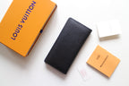 Small Louis Vuitton black textured cardholder with embossed LV logo, front view