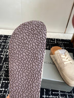 Beige sneaker outsole with textured rubber tread