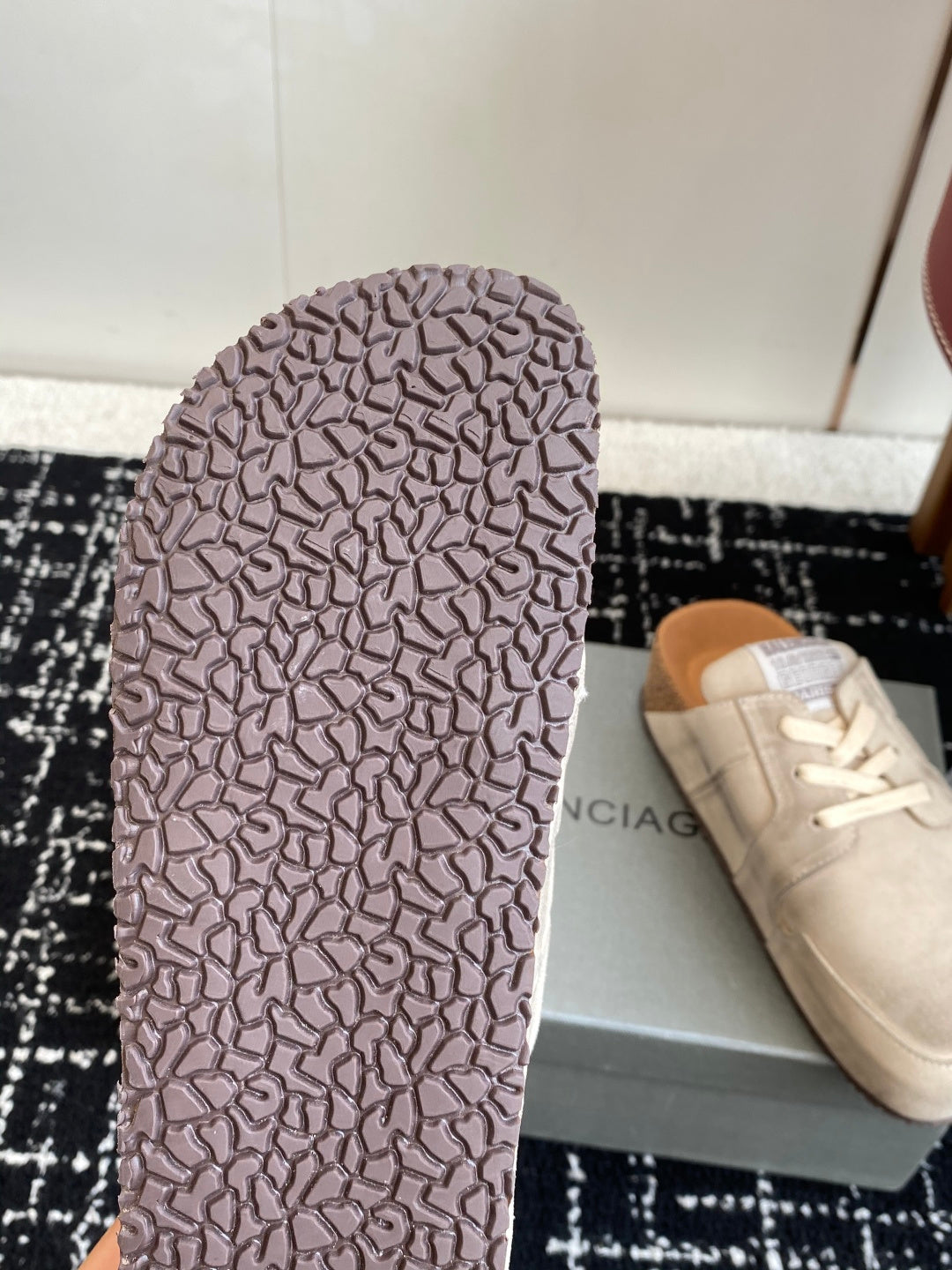 Beige sneaker outsole with textured rubber tread