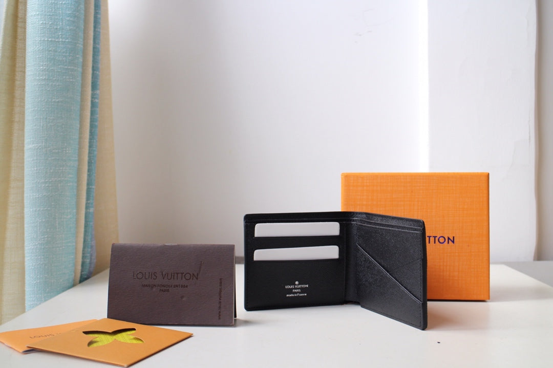 Louis Vuitton wallet opened to show card slots and interior