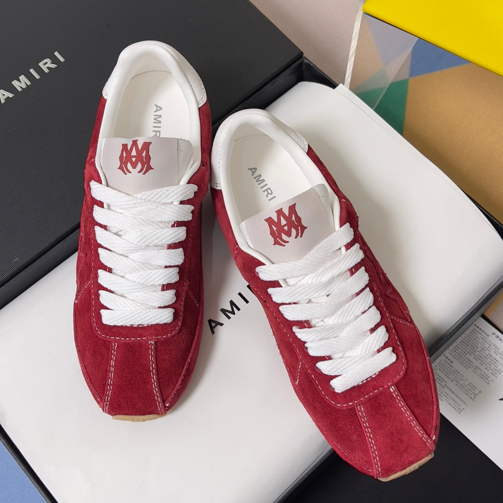 Amiri red suede sneakers with white laces, AMIRI branding on tongue, gum sole