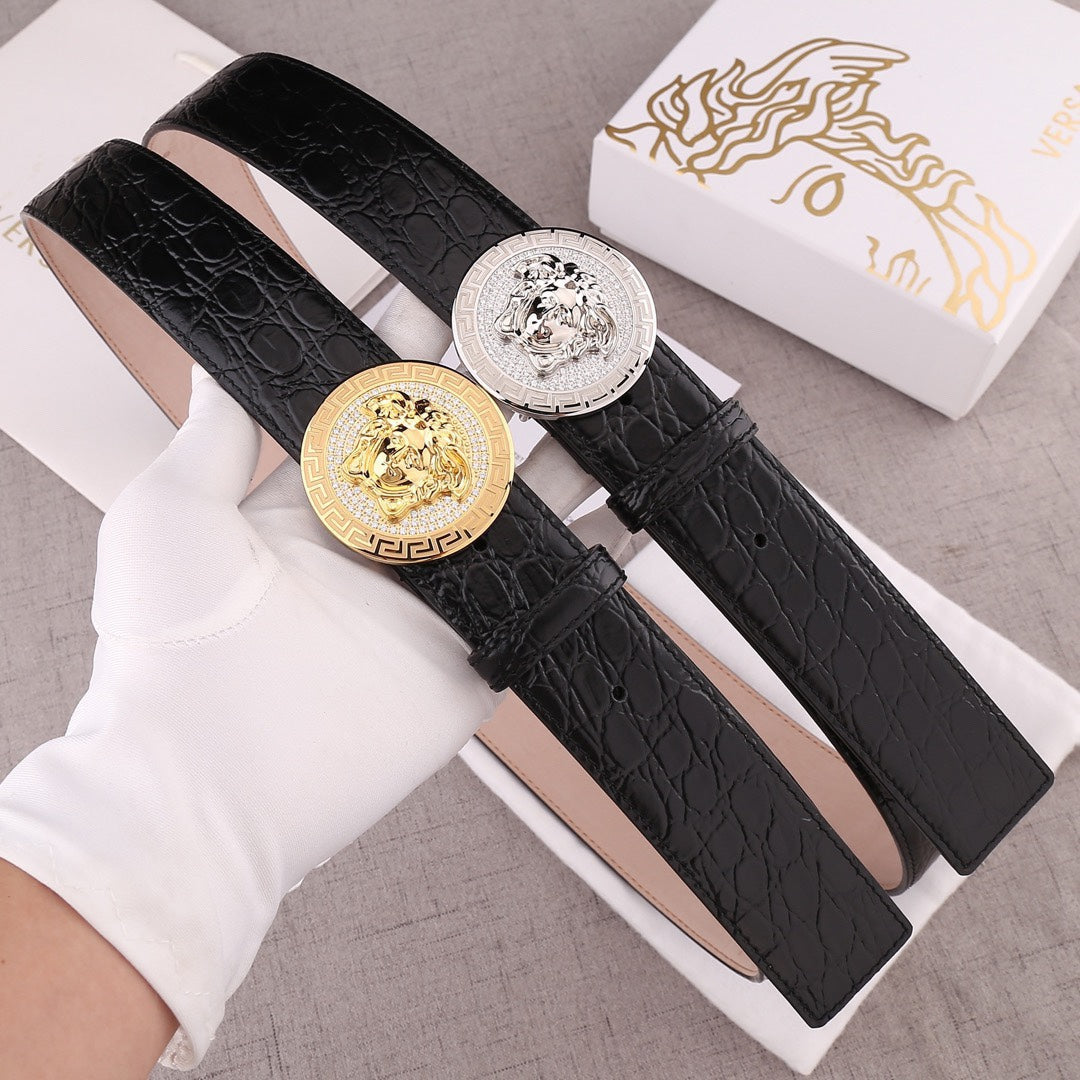 Versace belt pair: black embossed leather straps with gold and silver round Medusa buckles