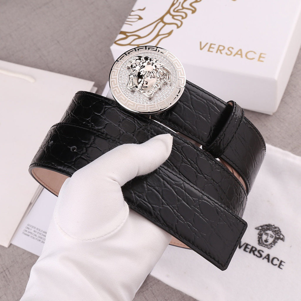 Versace belt with black embossed leather strap and silver round Medusa buckle, angled