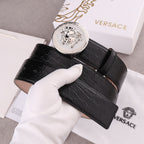 Versace belt with black embossed leather strap and silver round Medusa buckle, angled