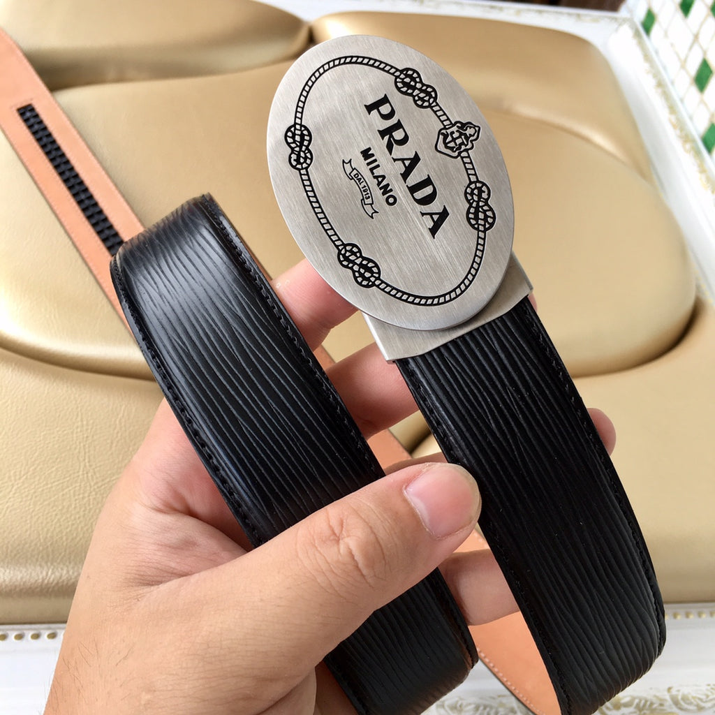 Prada belt pair view: black ribbed straps with tan underlay and oval logo label
