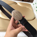 Prada belt with dark textured leather strap and oval silver logo buckle