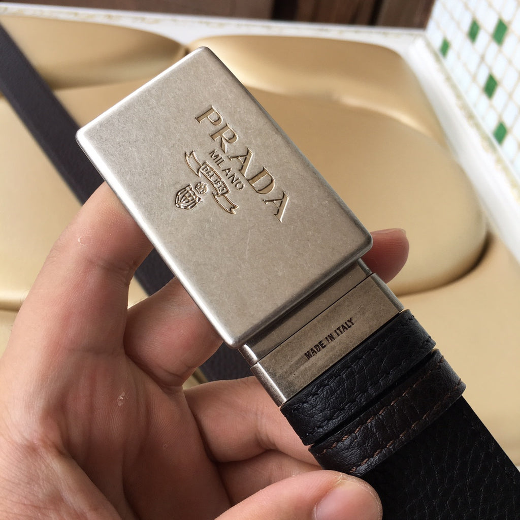 Prada leather belt with silver logo buckle and dark textured strap