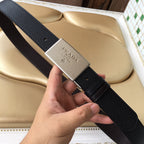 Prada leather belt with dark textured strap and silver rectangular buckle