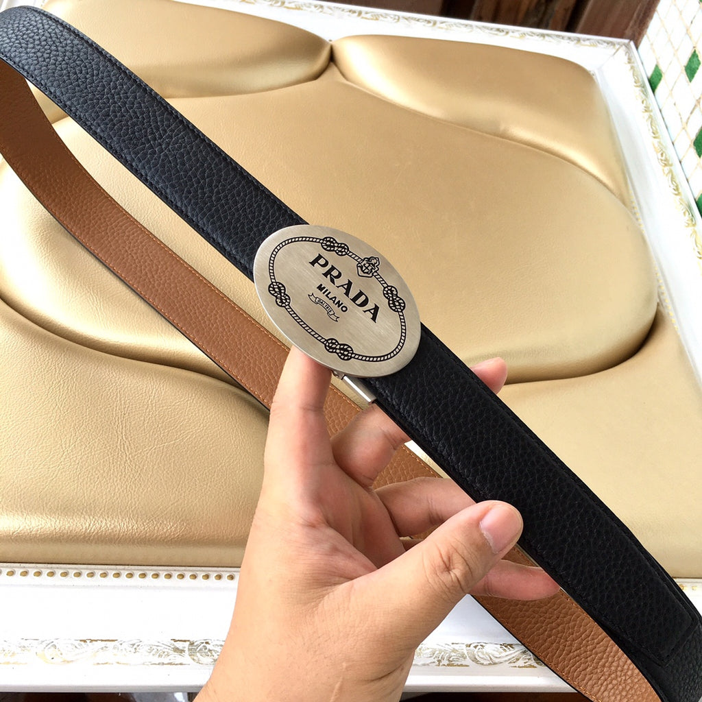 Leather belt with logo patch, two-tone strap in black and brown, handheld view