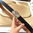 Leather belt with logo patch, two-tone strap in black and brown, handheld view