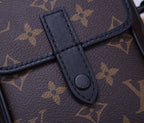 Louis Vuitton monogram bag front strap attachment with stitched tab and snap