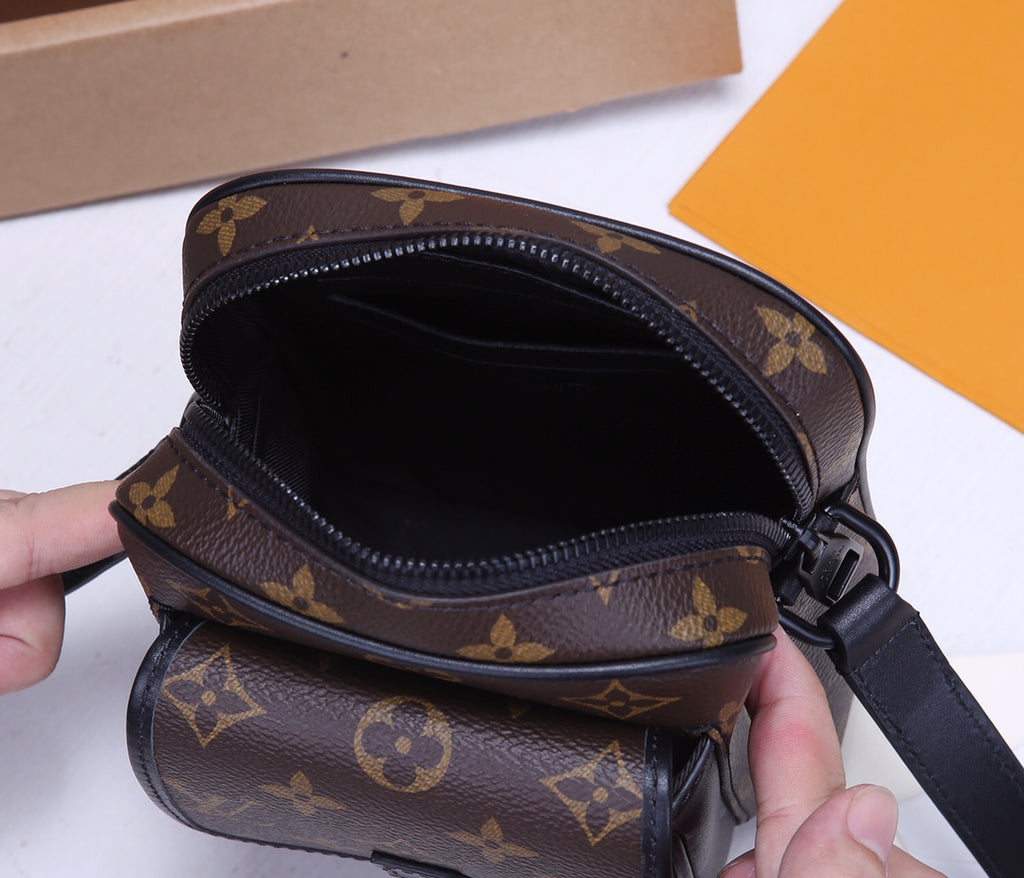 Louis Vuitton monogram crossbody bag open top showing dark interior lining