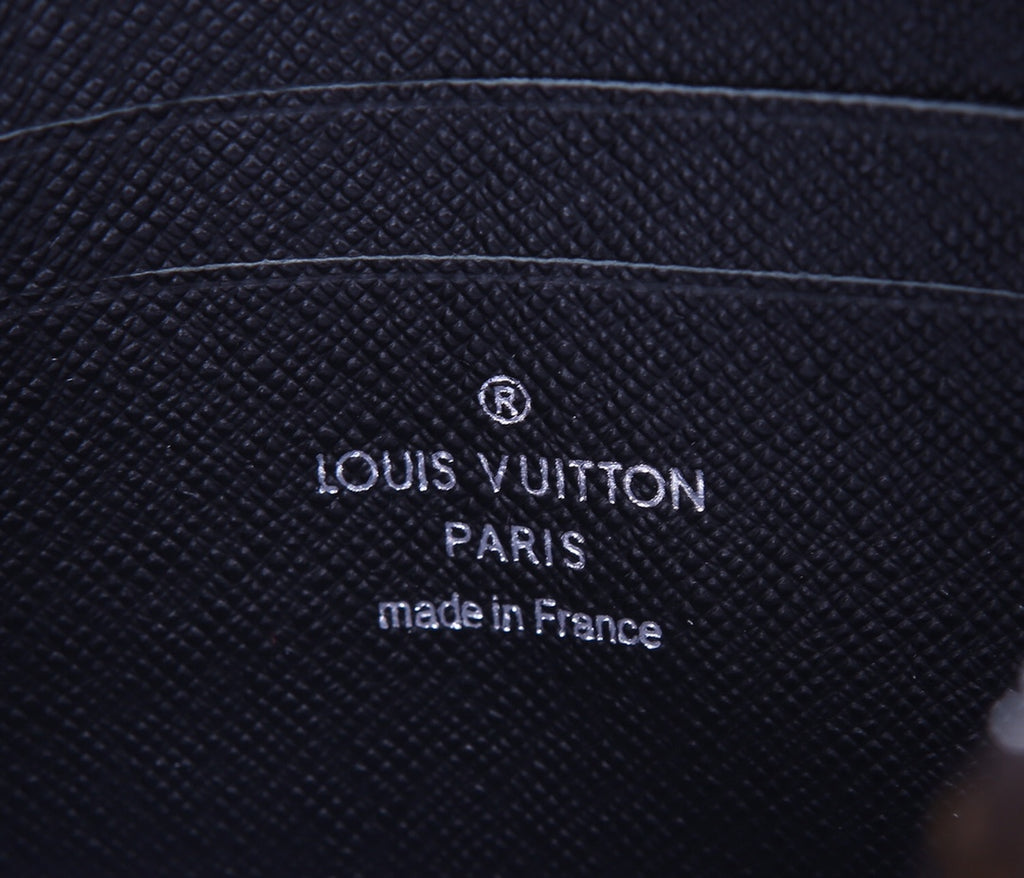 Louis Vuitton Paris made in France stamp on textured dark leather