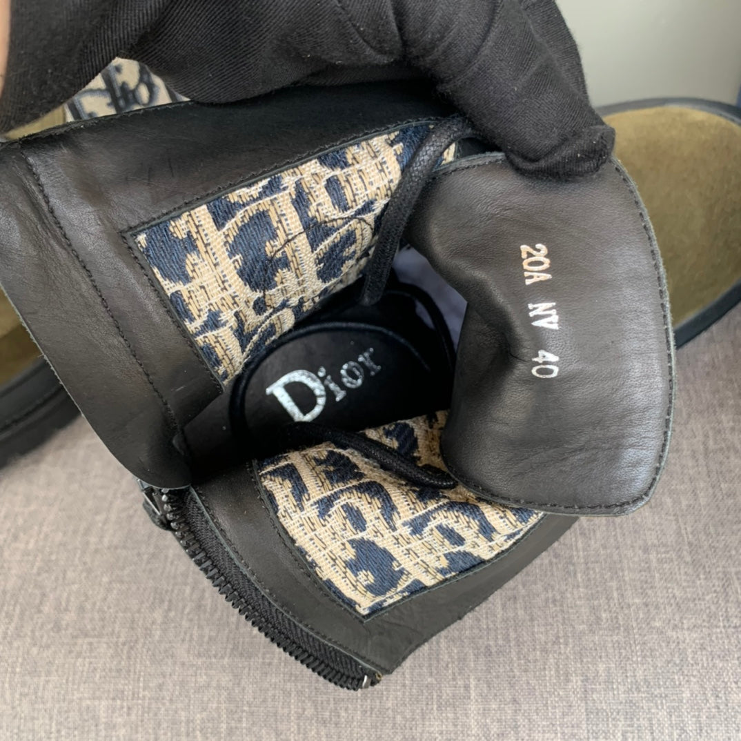 Dior-branded boot interior with printed lining and size tag on gray insole