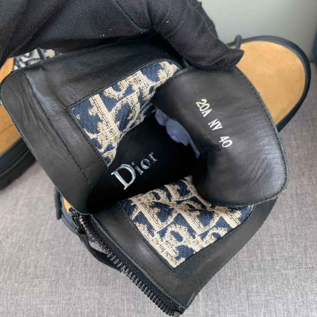 Black interior ankle boots with Dior Oblique lining and Dior branding on insole