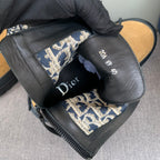 Black interior ankle boots with Dior Oblique lining and Dior branding on insole