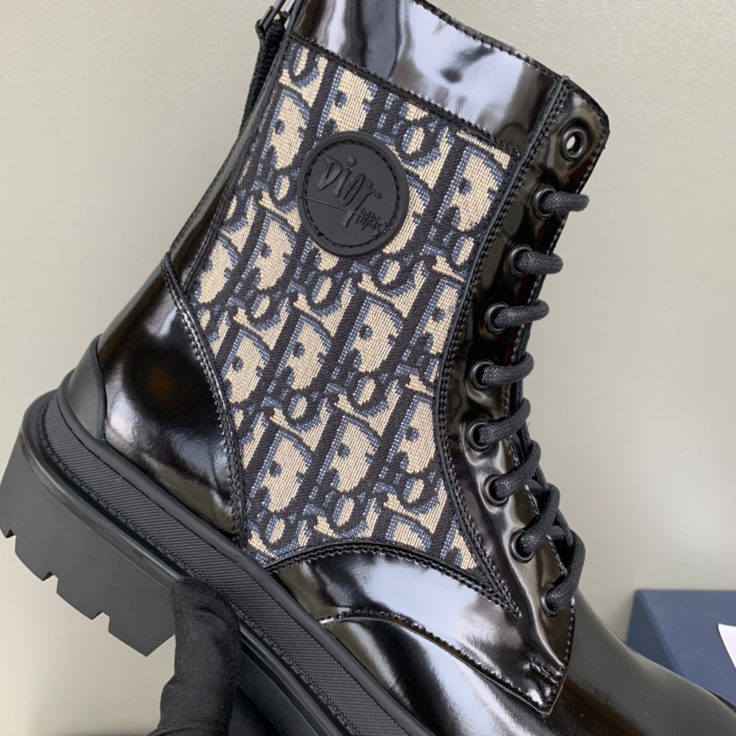 Dior unisex high-top boot close-up, beige monogram canvas, black laces and logo patch