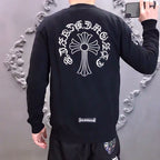 Black long-sleeve sweatshirt with large back cross-flower graphic and small chest patch