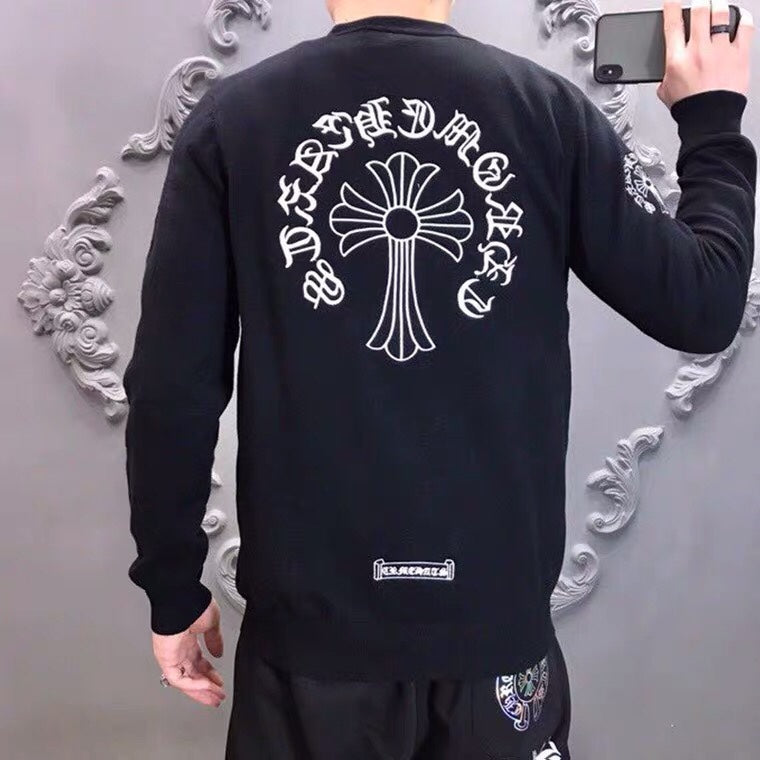 Black long-sleeve sweatshirt with large back cross-flower graphic and small chest patch