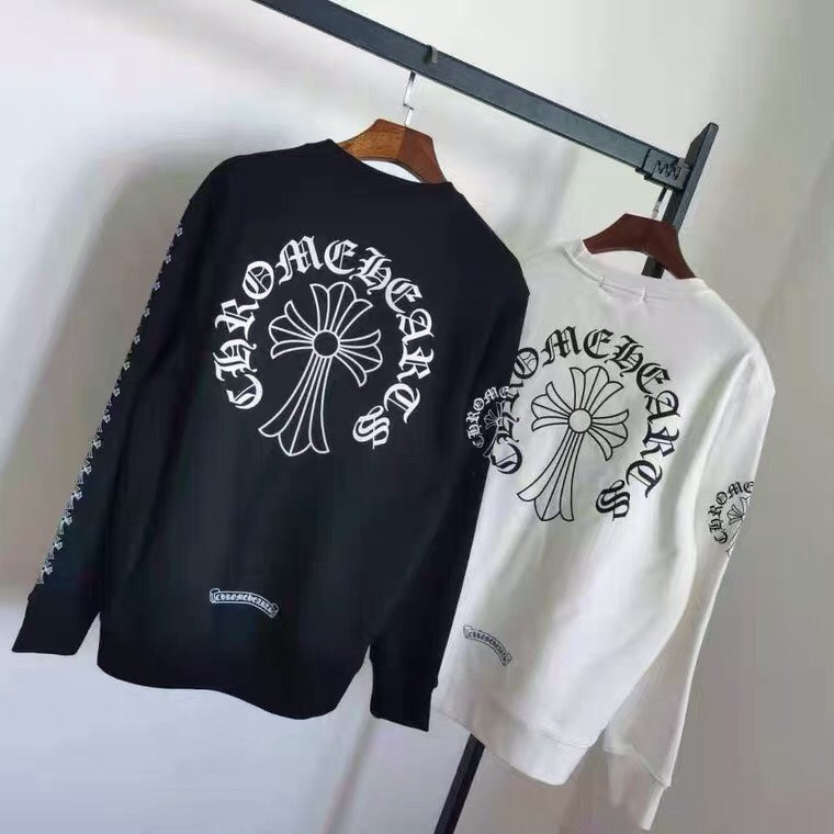 Black and white long-sleeve sweatshirts with large cross-style chest prints on hangers
