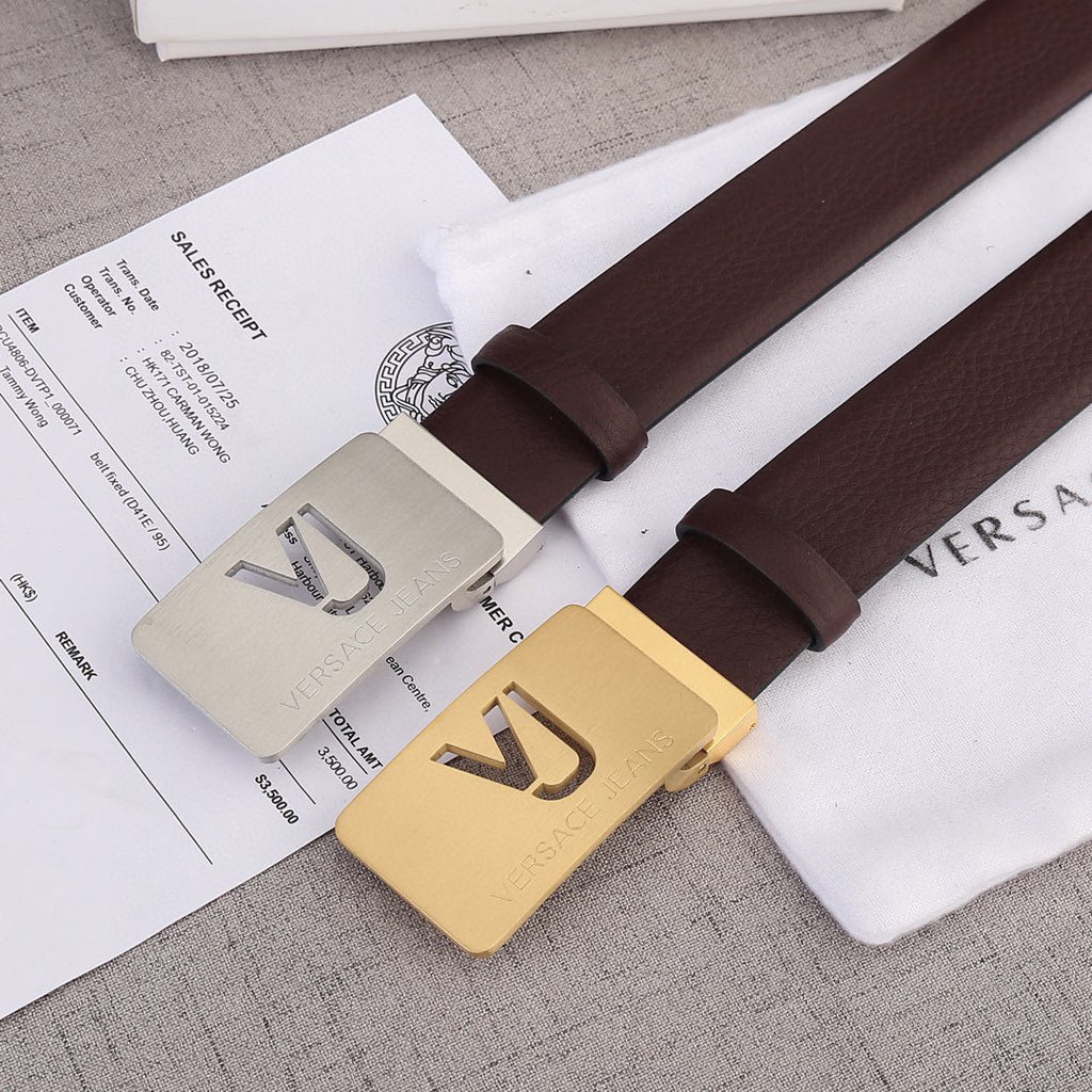 Brown leather belt with gold-toned Versace buckle and metal strap keeper