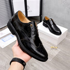 Versace black leather oxford shoe with lace-up front and gold-tone hardware