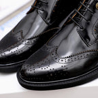 Versace black oxford shoes close-up showing wingtip brogue and perforations