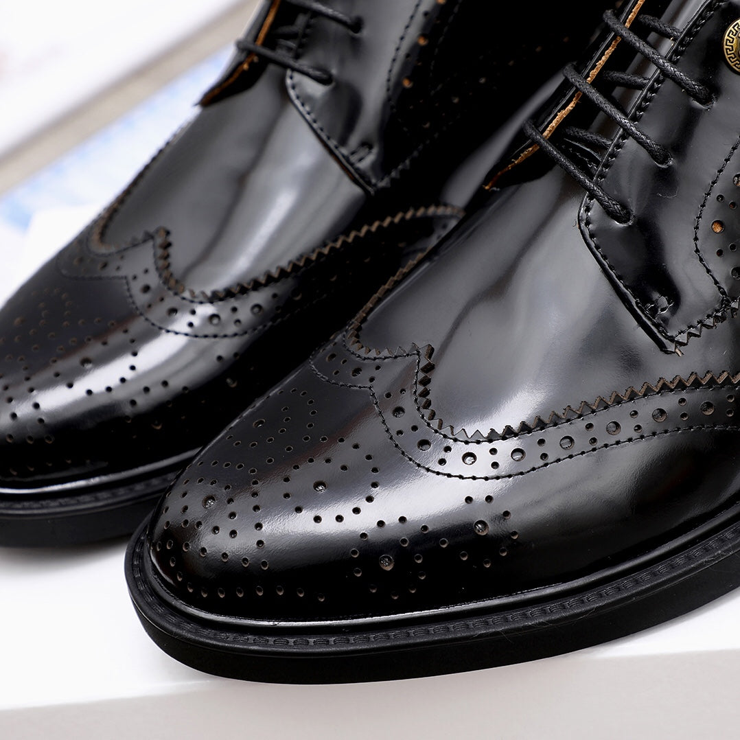 Versace black oxford shoes close-up showing wingtip brogue and perforations